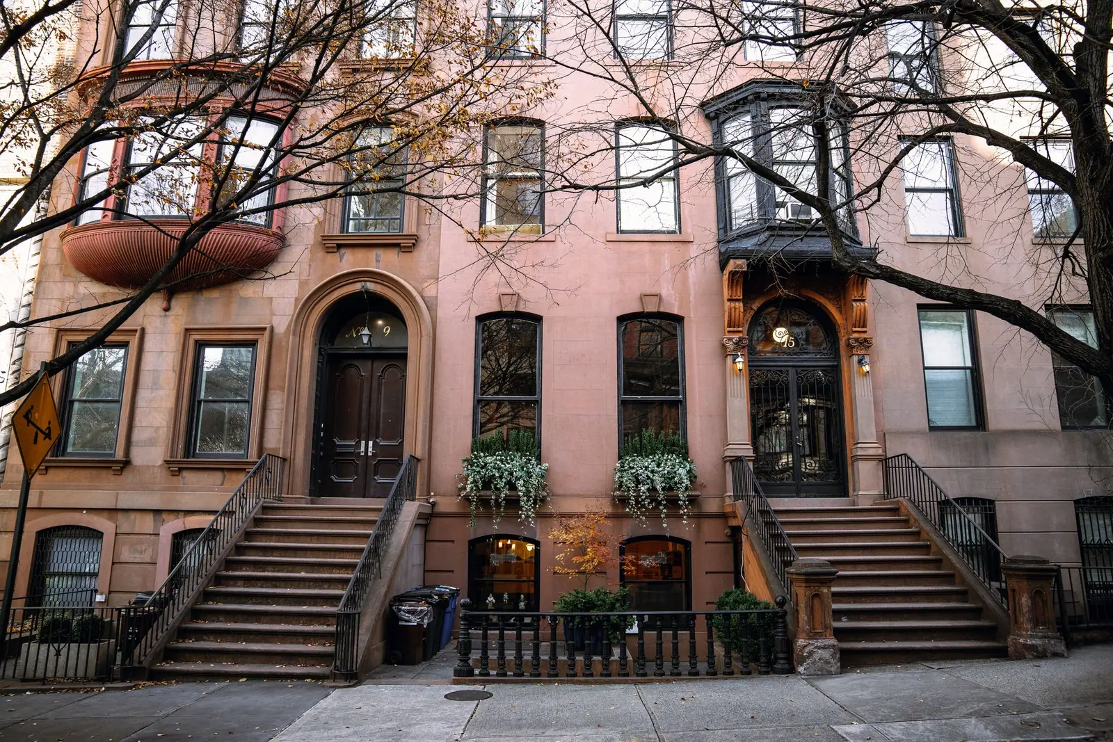 Brooklyn brownstone row houses with high stoops and iron railings in autumn